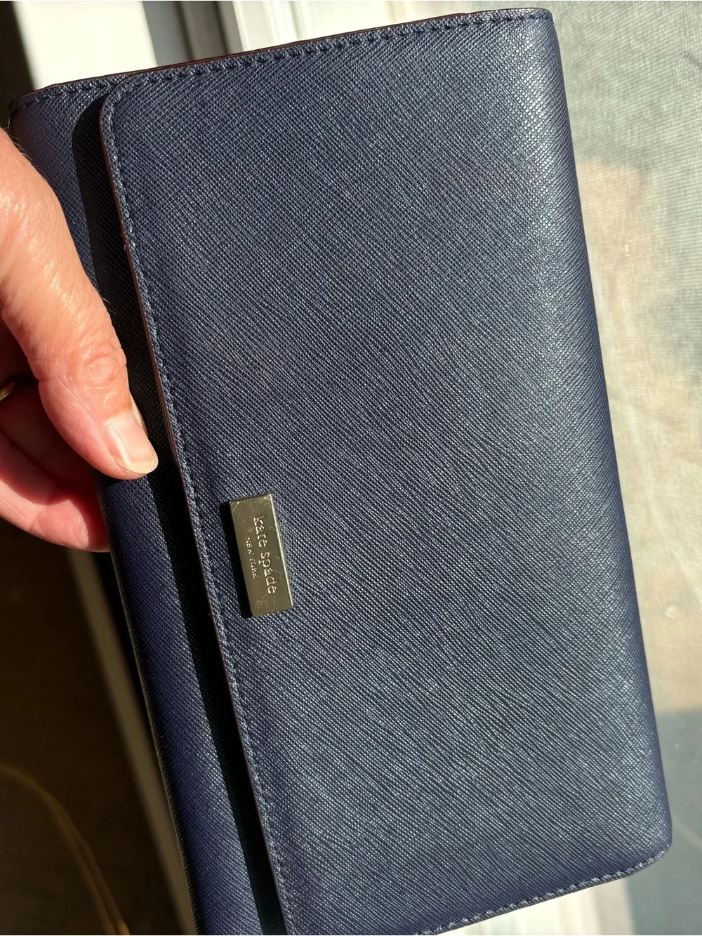 kate spade navy saffiano bifold wallet with gold logo plaque